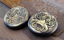 Load image into Gallery viewer, Prescience- A brass worry coin, engraved with a mystic octopus